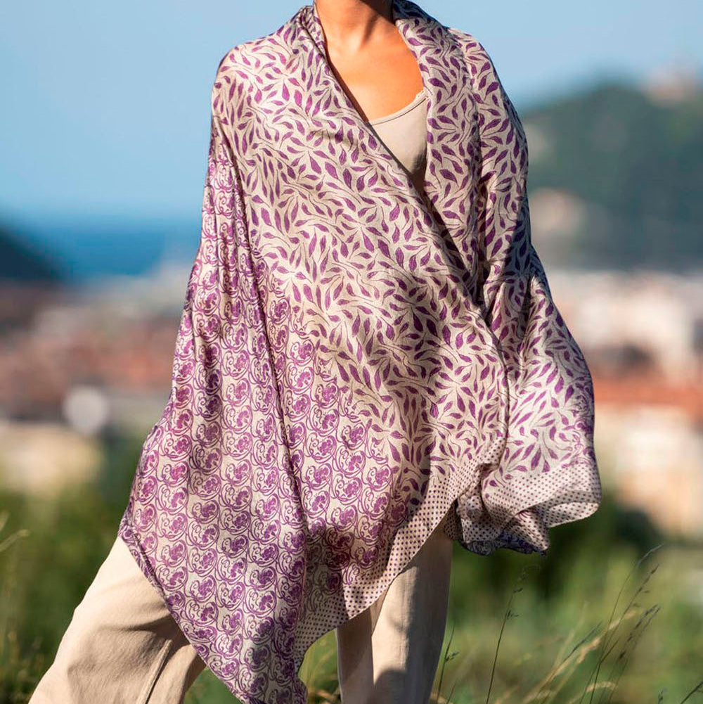 Women with large purple scarf with floral print