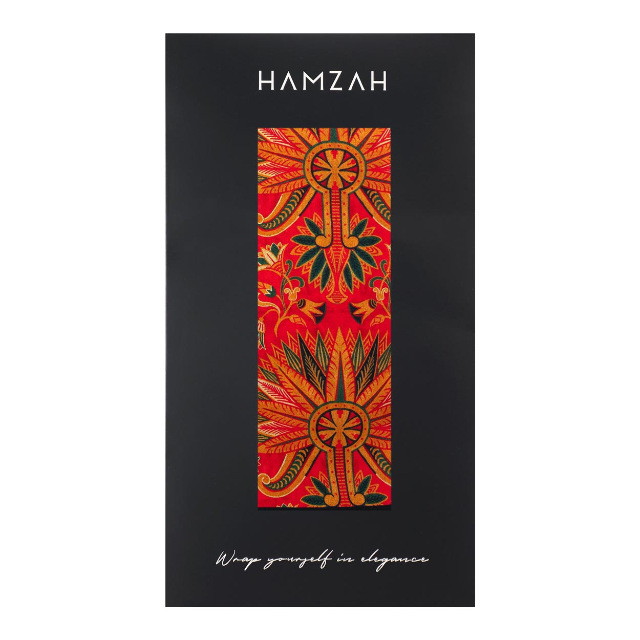 Hamzah-branded packaging with a window displaying the red silk scarf’s bold design, featuring the slogan ‘Wrap yourself in elegance’ beneath.