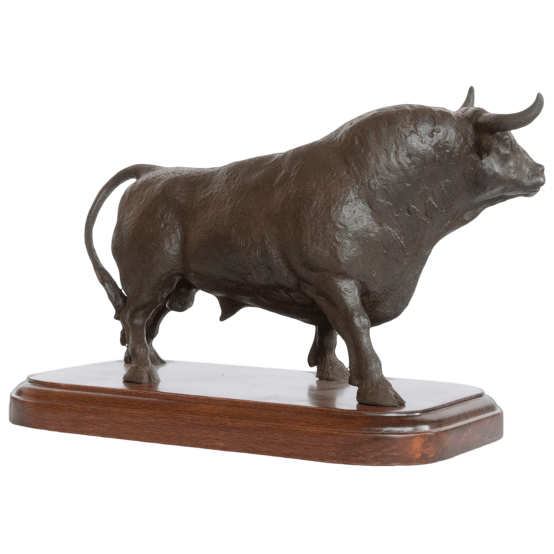 Large bull sculpture made of bronze and wood base