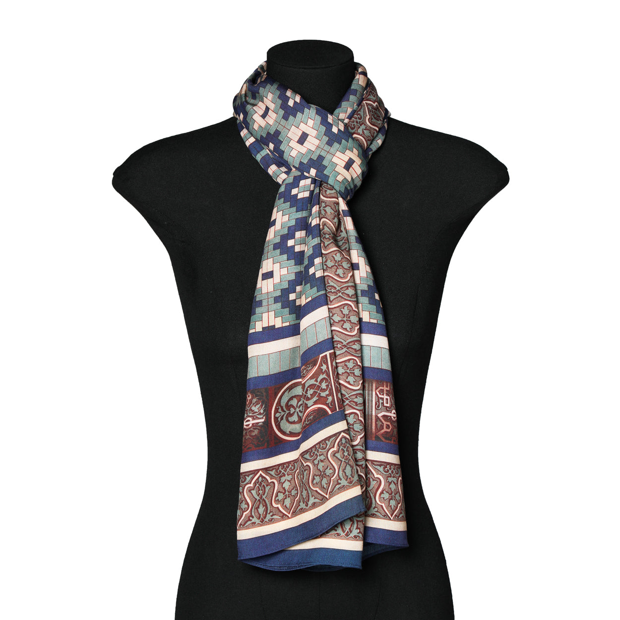 Mannequin styled with blue, green, and beige Islamic print scarf.
