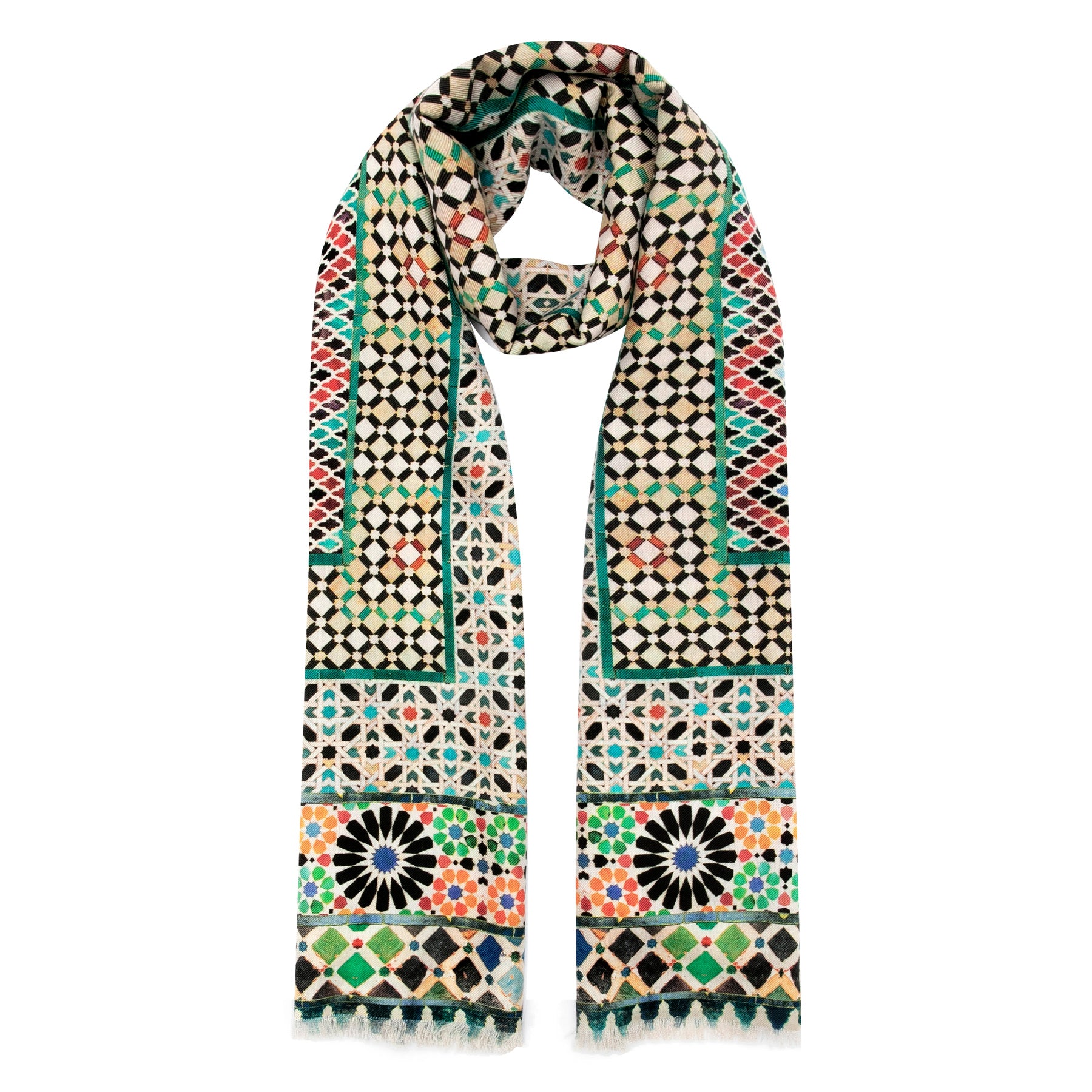 The Silk and Wool Scarf Mehdya by Hamzah showcases a luxurious design with geometric patterns inspired by Islamic art. Displayed on a white background, it features diamond shapes and floral motifs in black, white, red, green, blue, and orange.