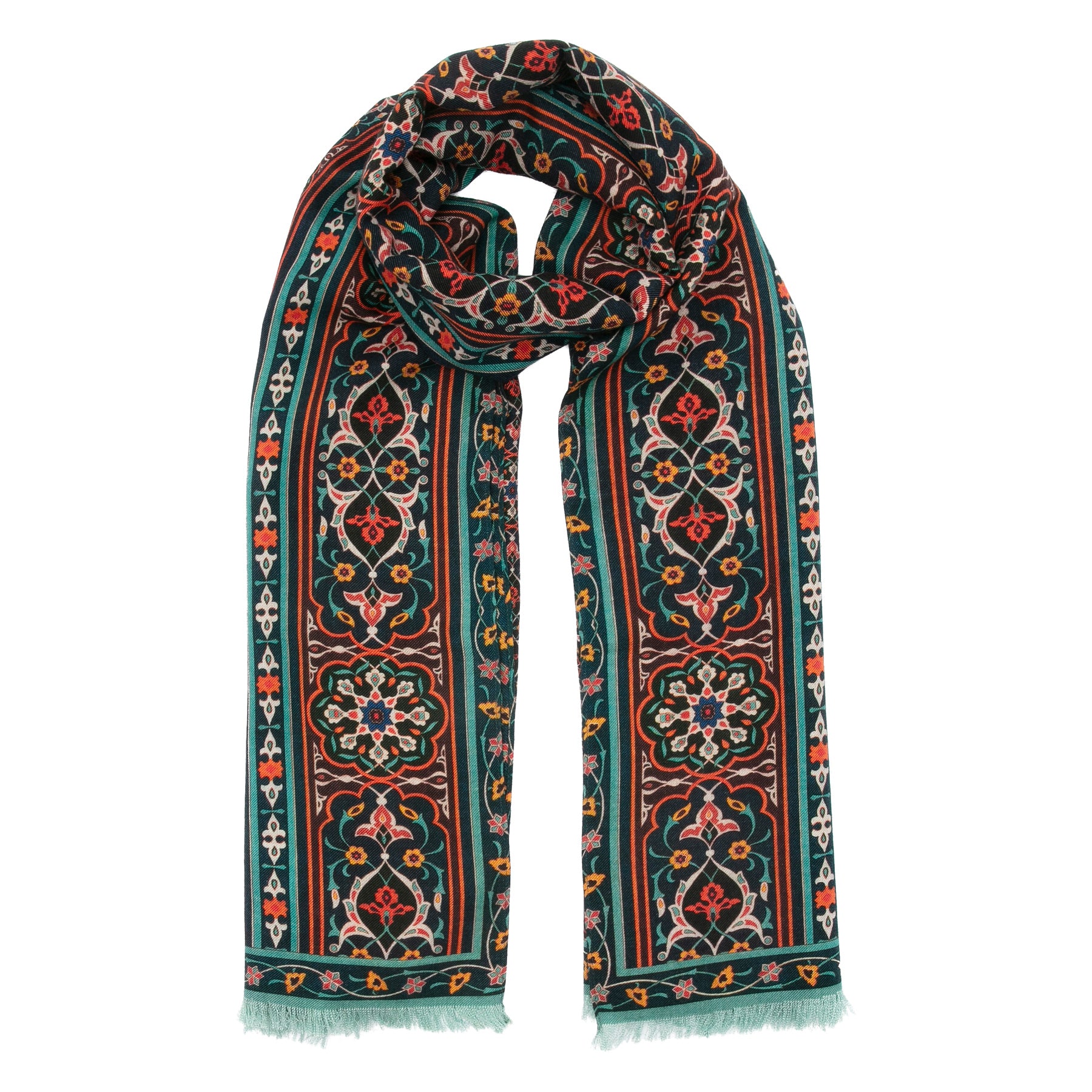 The Silk and Wool Large Scarf Zarafshan by Hamzah is a fashion accessory featuring intricate floral and geometric patterns in red, green, and white. This colorful scarf is neatly knotted at the top, highlighting its detailed design with fringed edges on the bottom.