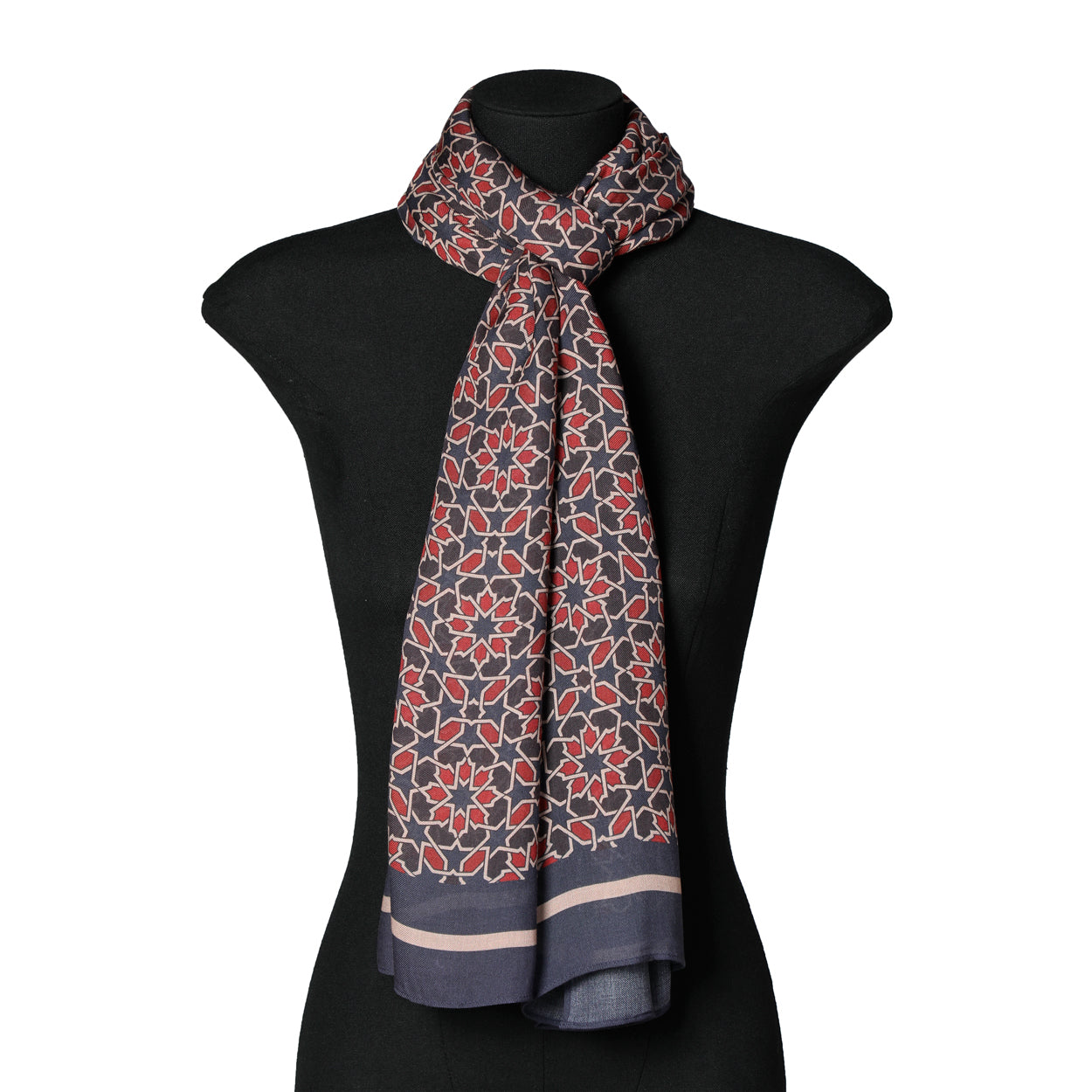 Mannequin displaying a navy blue and red geometric modal scarf