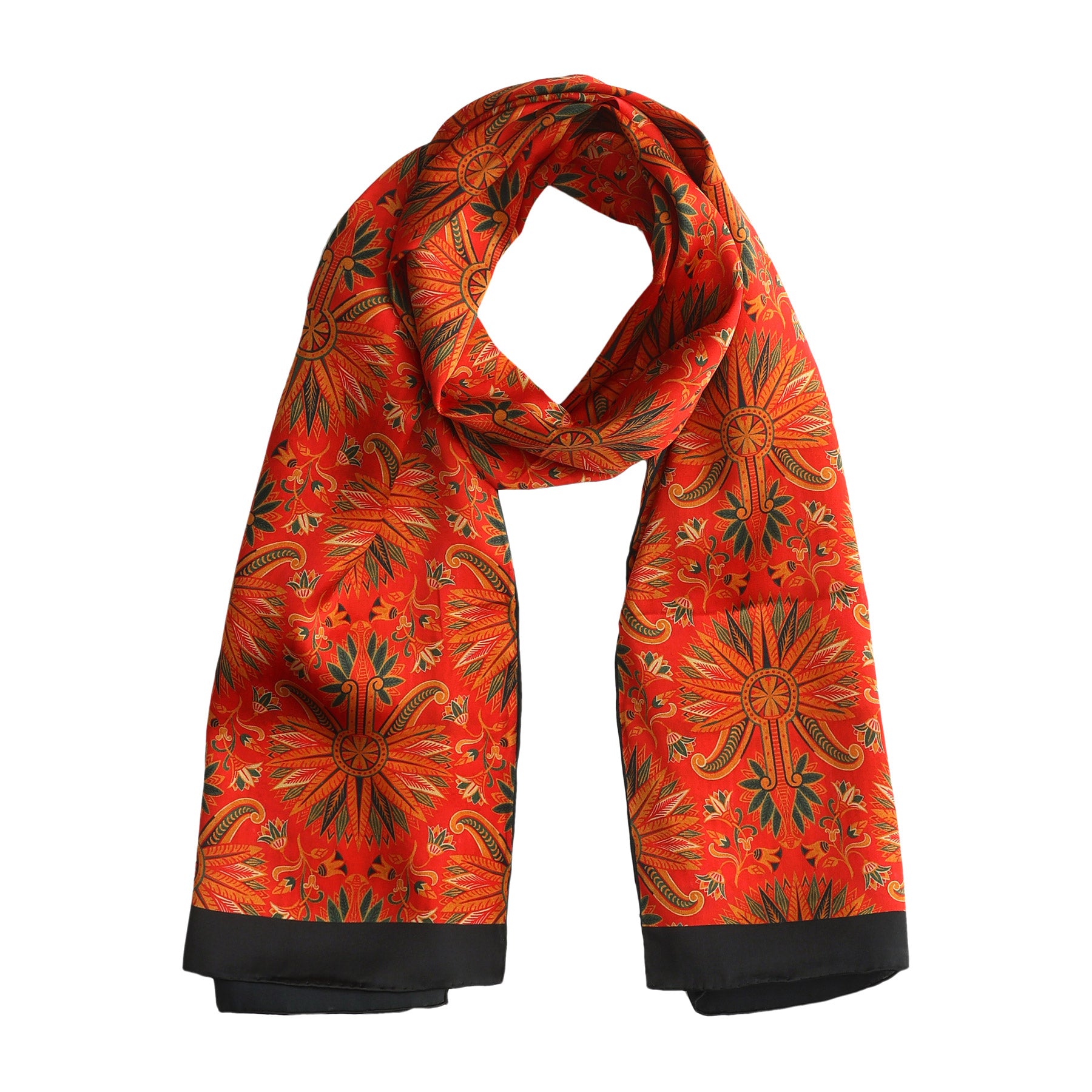 Red silk scarf adorned with golden and green floral patterns, draped and lightly knotted, featuring black trim that accentuates its elegant style.