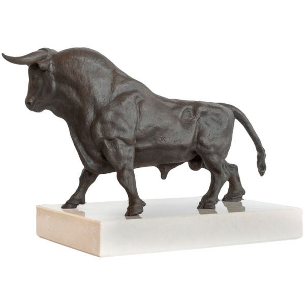 Side view of fighting bull bronze sculpture with marble base