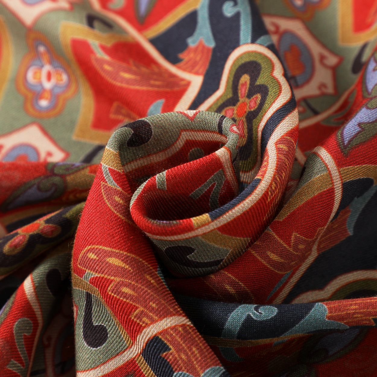 Close-up of the texture detail of the blue and red scarf with intricate Turkish patterns.