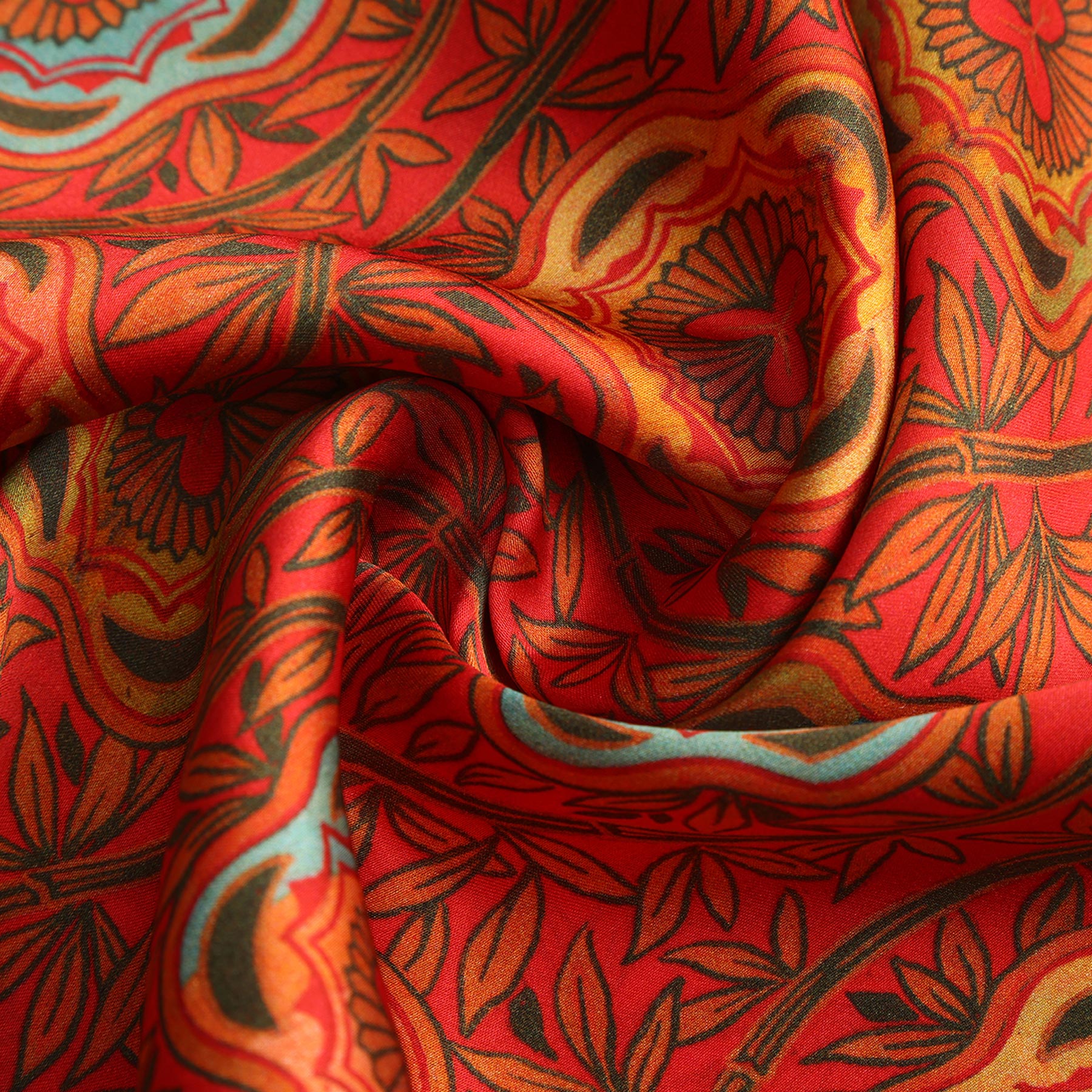 The Red and Blue Scarf with Floral Print Marigold features vibrant silk adorned with intricate orange, yellow, blue