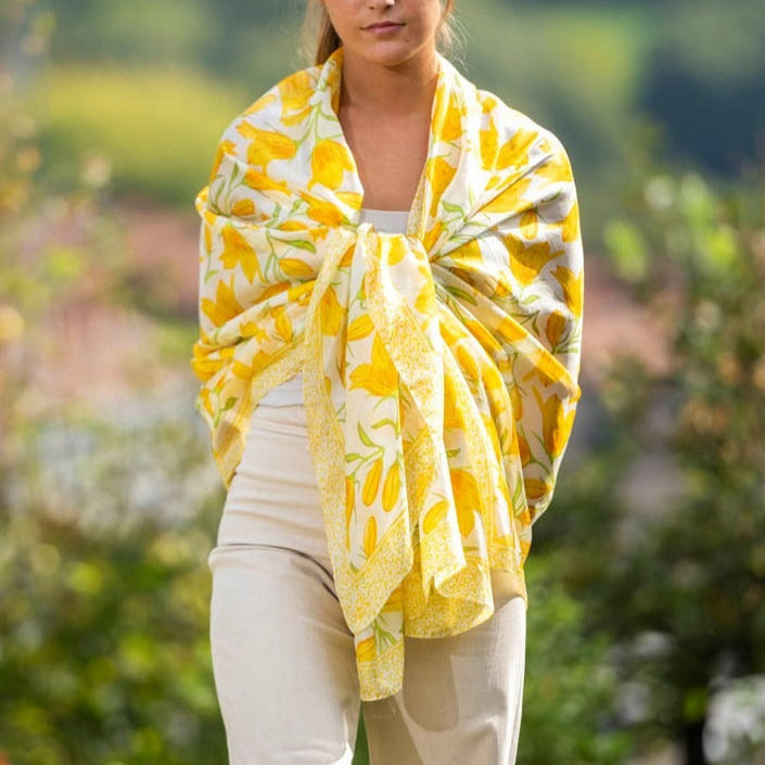 Woman using yellow scarf with floral print