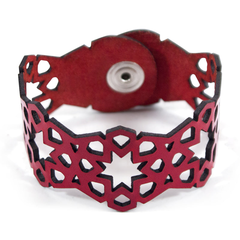 Red laser cut leather bracelet with islamic art inspired pattern