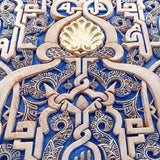 Detail of plaster work with arabic calligrapy with blue and gold details