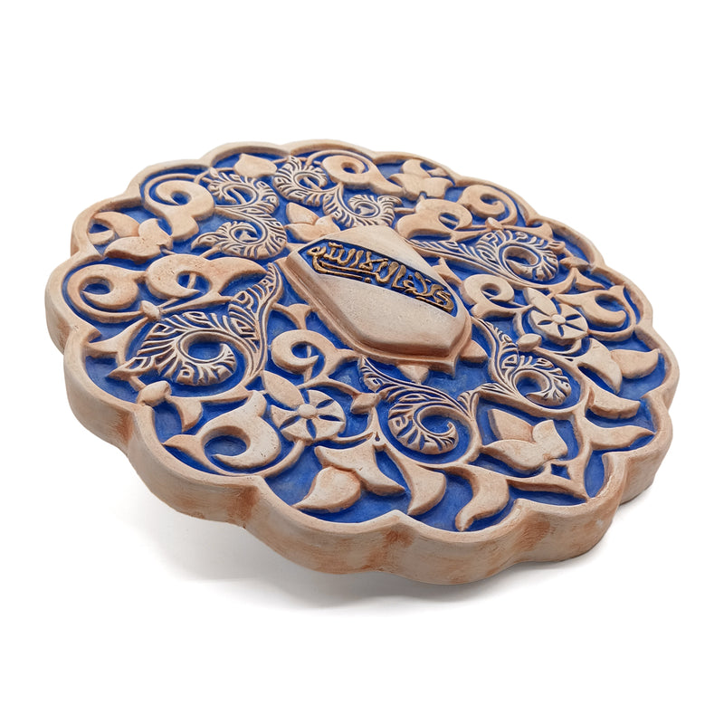 Carved plaster artwork in blue and brown hues for islamic home decor