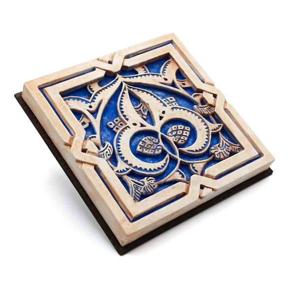 Blue and brown plaster artwork for wall hanging inspired by Islamic art