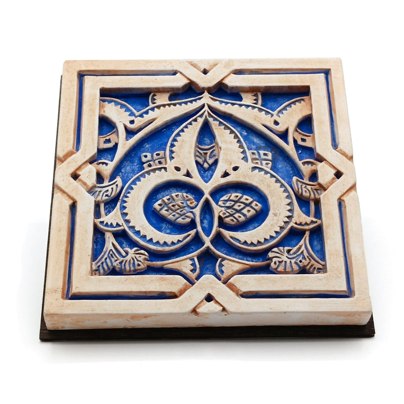 Blue and brown islamic geometry plaster artwork inspired by the Alhambra of Granada