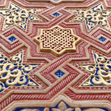 Detail of hand painted plaster art piece inspired by the walls of the Alhambra of Granada for modern islamic home decor