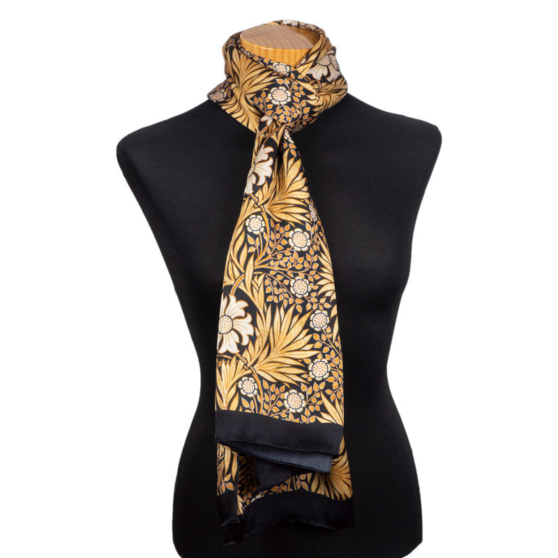 Large silk neck scarf with black and gold colored floral print