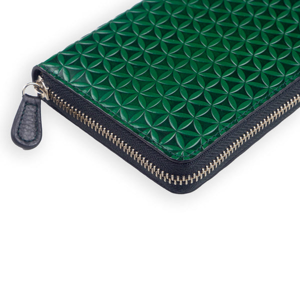 Green leather wallet with zipper closure and embossed with flower of life design