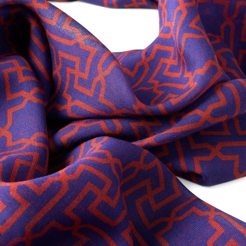 Detail of blue and red scarf with islamic art geometric print
