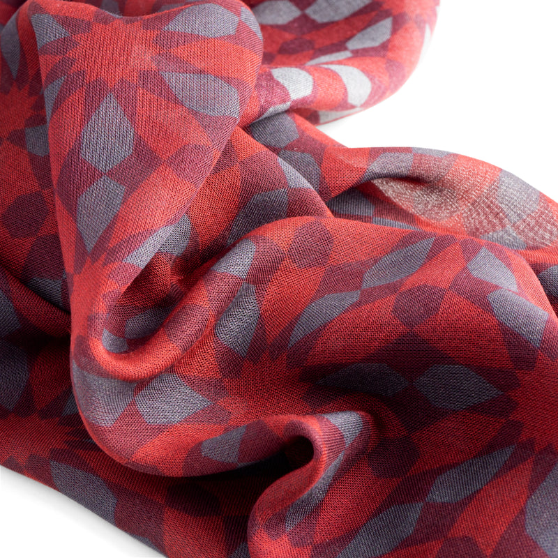 Detail of red scarf with gray details inspired by Islamic art