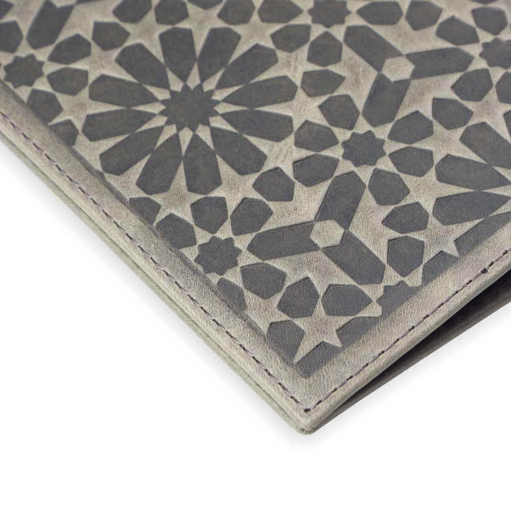 Detail of leather passport cover with islamic geometry pattern embossed