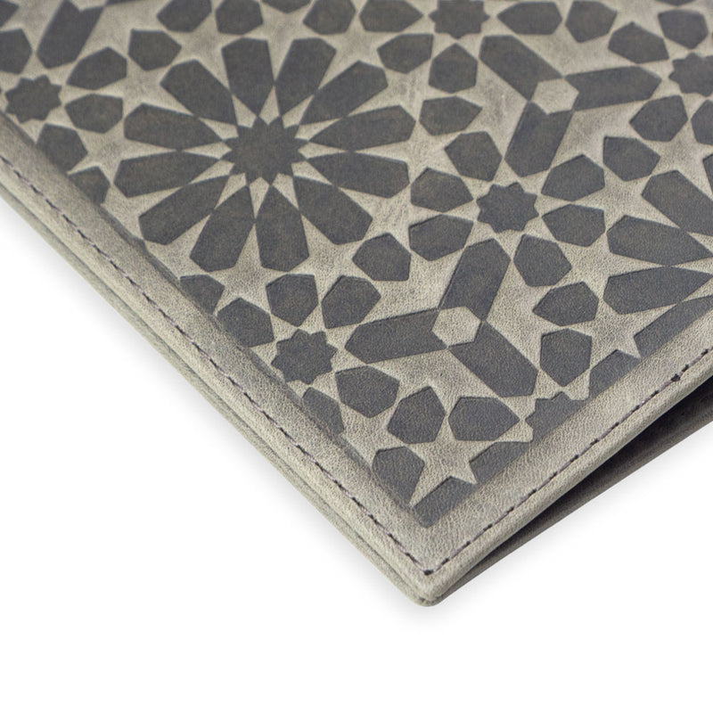Detail of leather passport cover with islamic geometry pattern embossed
