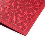 Detail of leather passport holder with moroccan embossed pattern