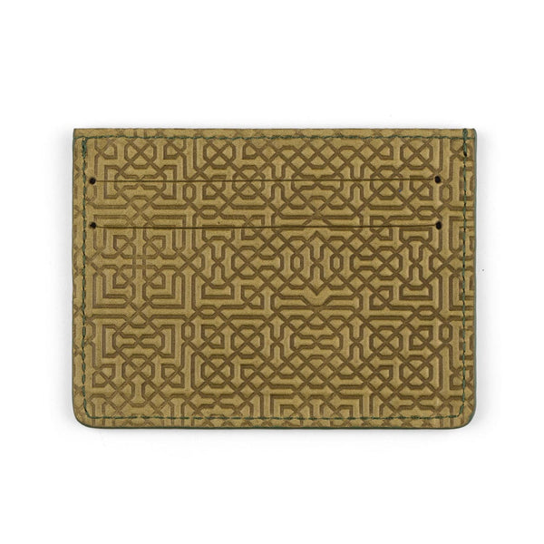 Green leather cardholder with embossed design inspired by moorish tiles