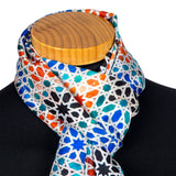 Silk neck wrap with orange, black and green pattern