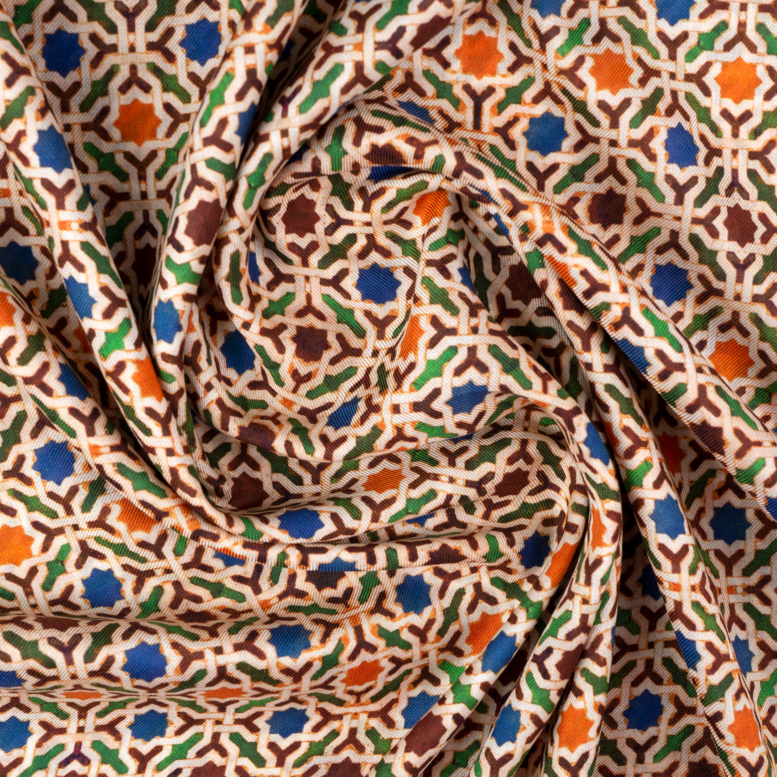 Detail of modal scarf with colorful print inspired by Andalusian tiles