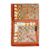 Close up of orange scarf with islamic art geometry print