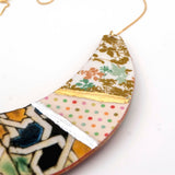 Detail of colorful necklace made with recycled paper and gold and silver hand painted touch