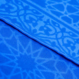 Hand-rolled edges of blue silk scarf