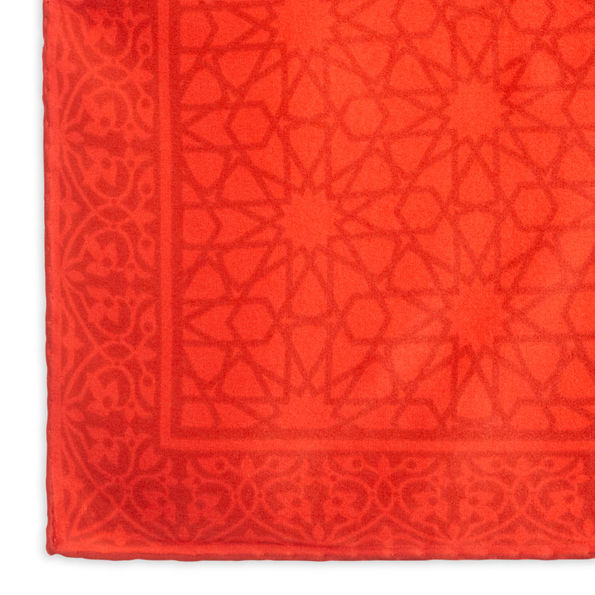 Detail of red square scarf with islamic art pattern