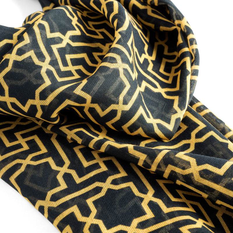 Detail of black and gold scarf inspired by Islamic art