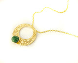 Islamic art inspired gold pendant with green stone