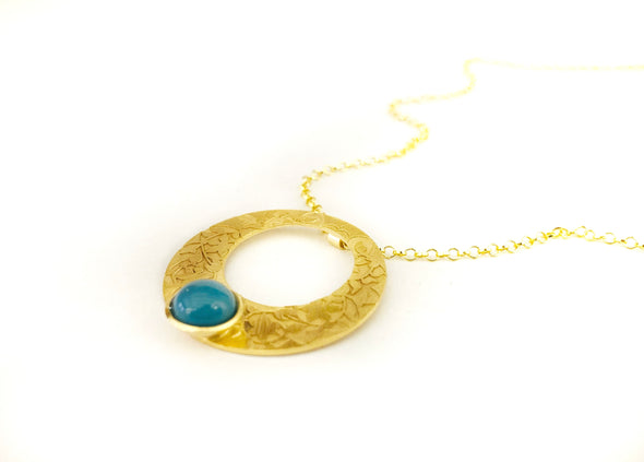 Blue and gold pendant with circle shape inspired by islamic art
