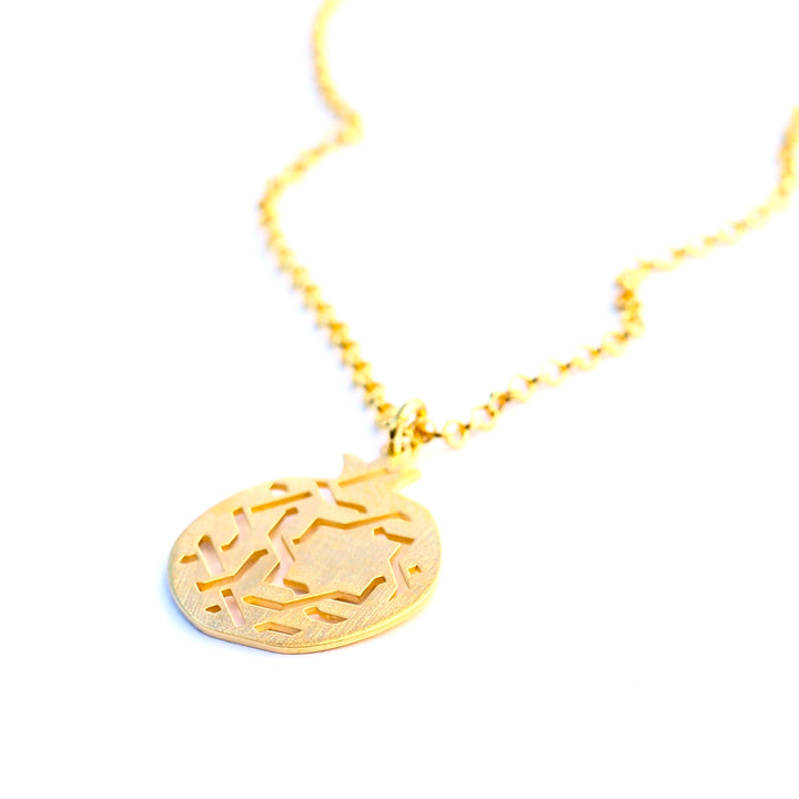 Arabesque inspired gold pendant