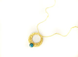 Islamic art inspired gold circle pendant with blue stone