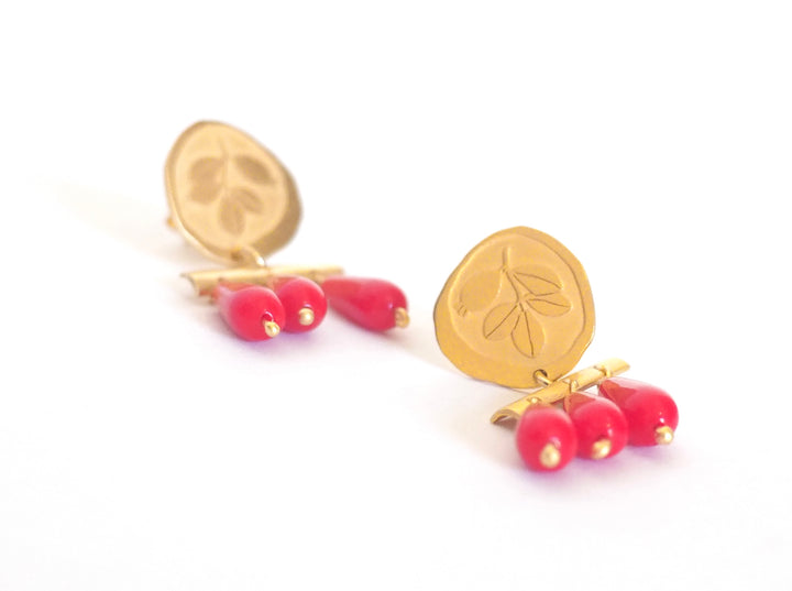 Red and gold earrings with floral motifs