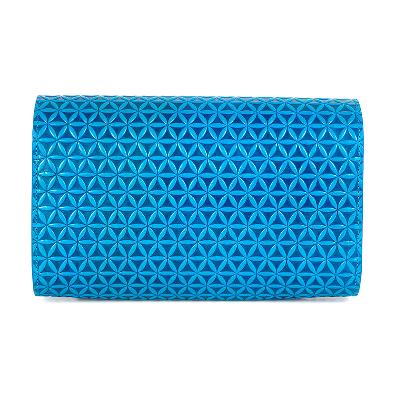 Back of a small blue clutch bag with flower of life pattern