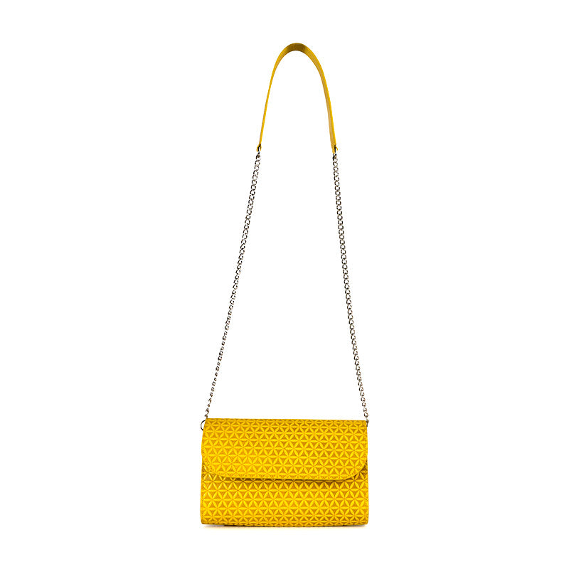 Small yellow leather clutch bag with metal and leather strap and embossed flower of life