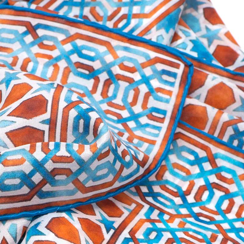 Detail of brown and blue silk scarf with islamic tiles print