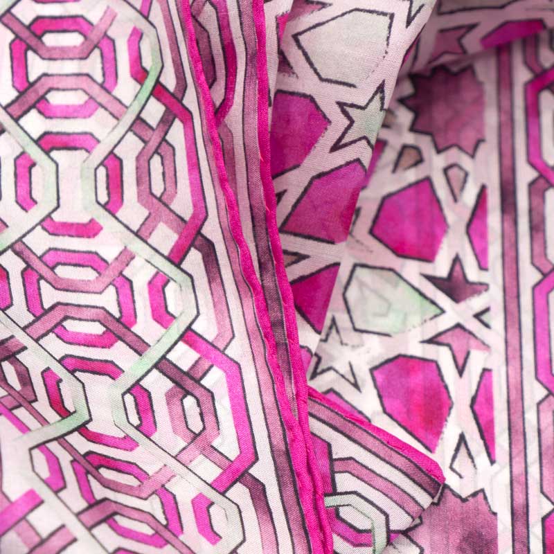 Detail of hand-rolled pink silk scarf with islamic art print