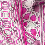 Detail of hand-rolled pink silk scarf with islamic art print