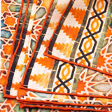 Detail of islamic art inspired orange silk scarf