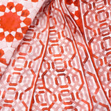 Detail of red and white silk scarf with geometric print