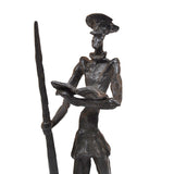 Bronze sculpture of don quixote of la mancha reading a book