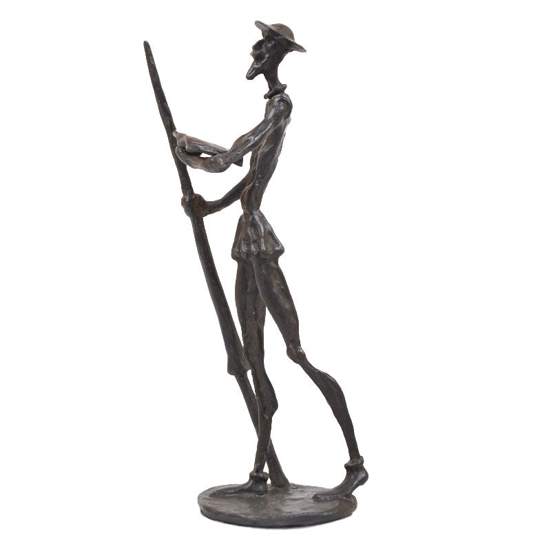 Bronze sculpture of don quixote of la mancha with a book