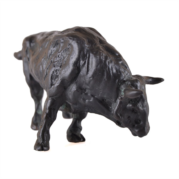 Grazing bull sculpture made with bronze