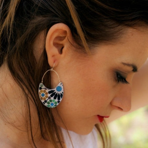 Woman with big earrings inspired by Andalusian tiles