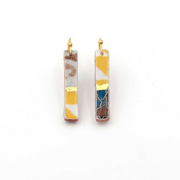 Thin rectangle earrings with hand painted 24k gold details and inspired by Islamic patterns